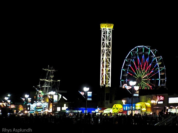 Ocean City Boardwalk at busy night hours with the Ferris wheel lit up